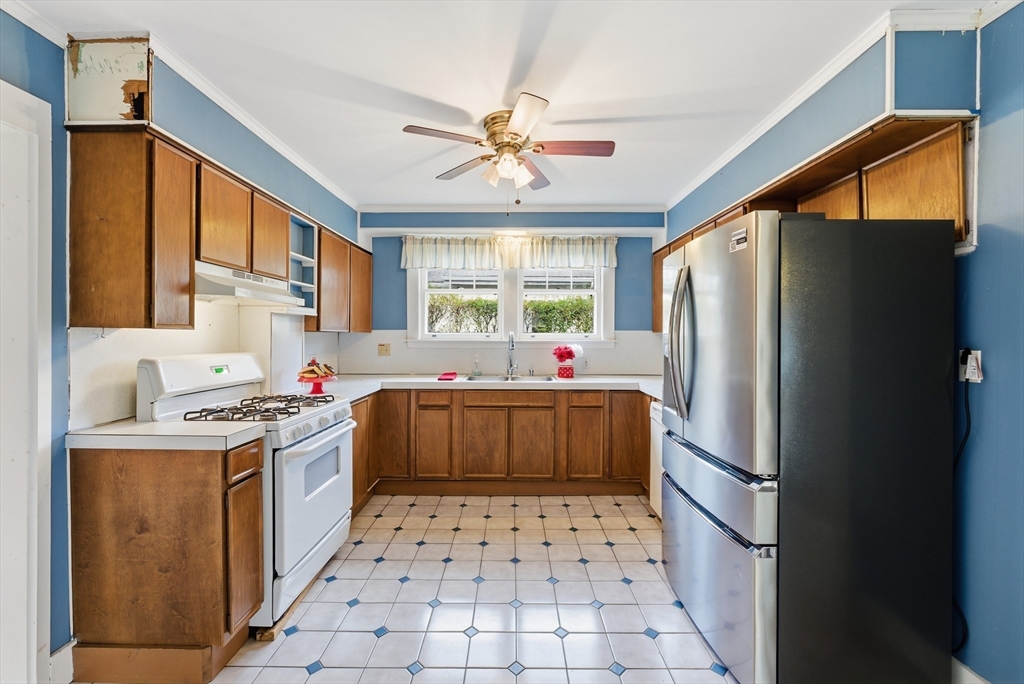 63 Webber Street Springfield, MA 01108 - Photo 9 of 40 a kitchen with stainless steel appliances a stove a refrigerator and a cabinets
