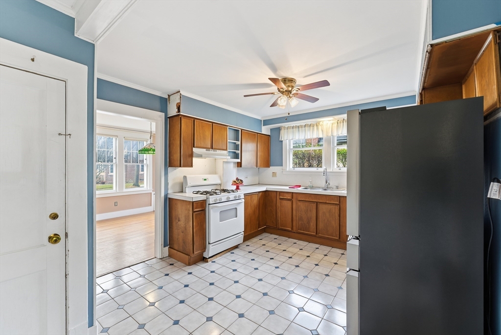 63 Webber Street Springfield, MA 01108 - Photo 10 of 40 a large kitchen with a stove a refrigerator and a stove top oven