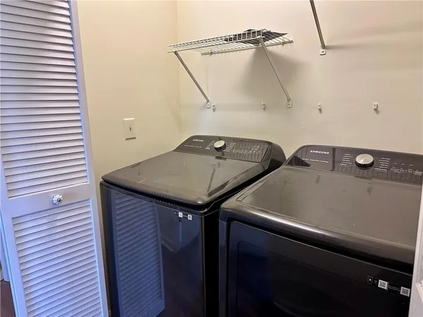 a utility room with dryer and washer