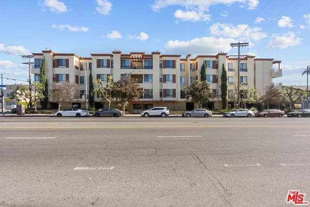 a city street lined with buildings and cars
