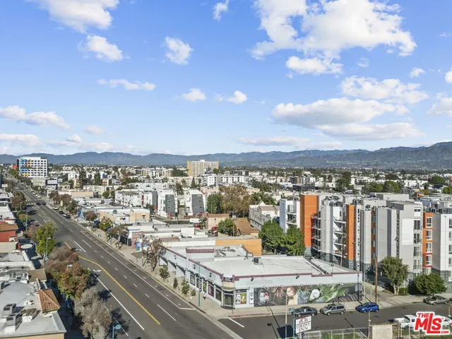 aerial view of a balcony with chairs and a table
