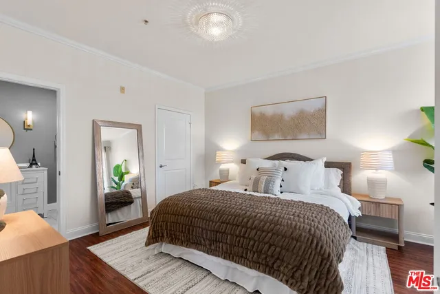 a bedroom with a bed and a dresser