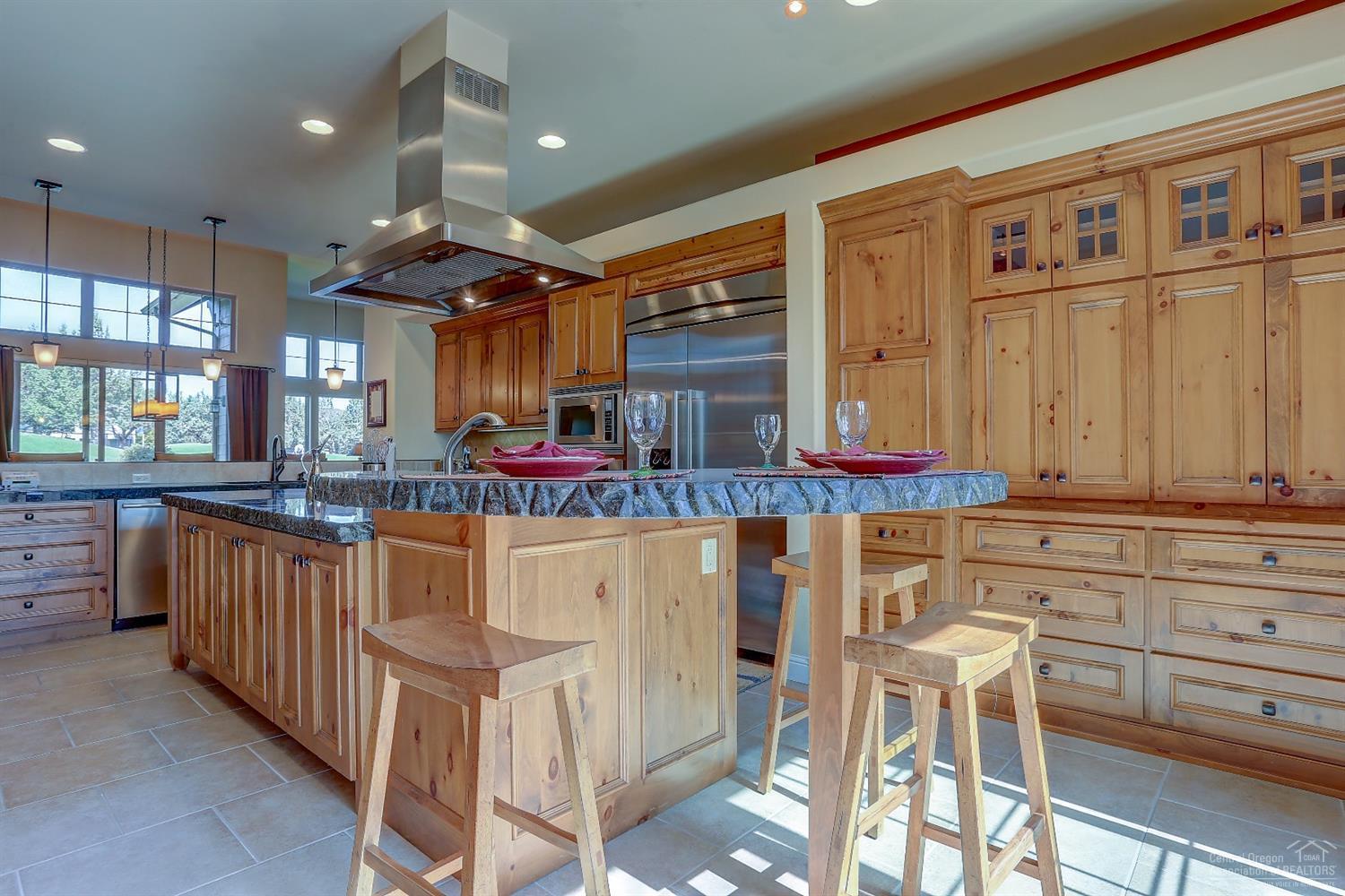 8915 Merlin Drive Redmond, OR 97756 - Photo 8 of 25 Plenty of cabinets to store all those ki