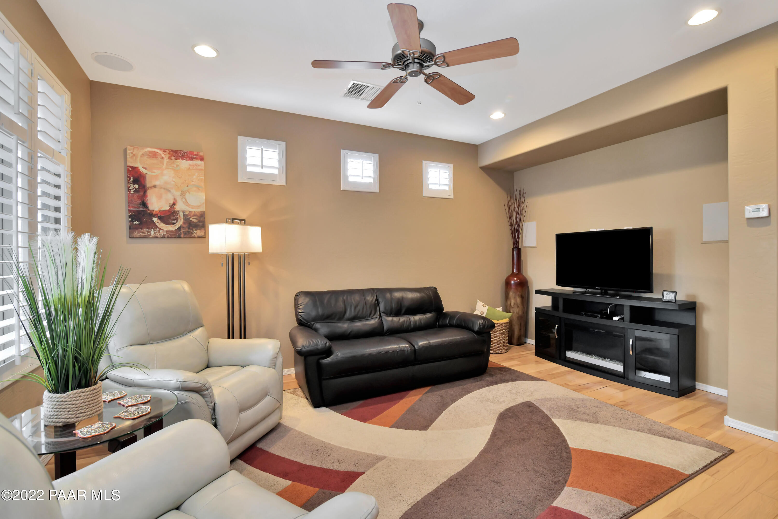 7209 Woolsey Ranch Road Prescott Valley, AZ 86314 - Photo 12 of 49 a living room with furniture and a flat screen tv