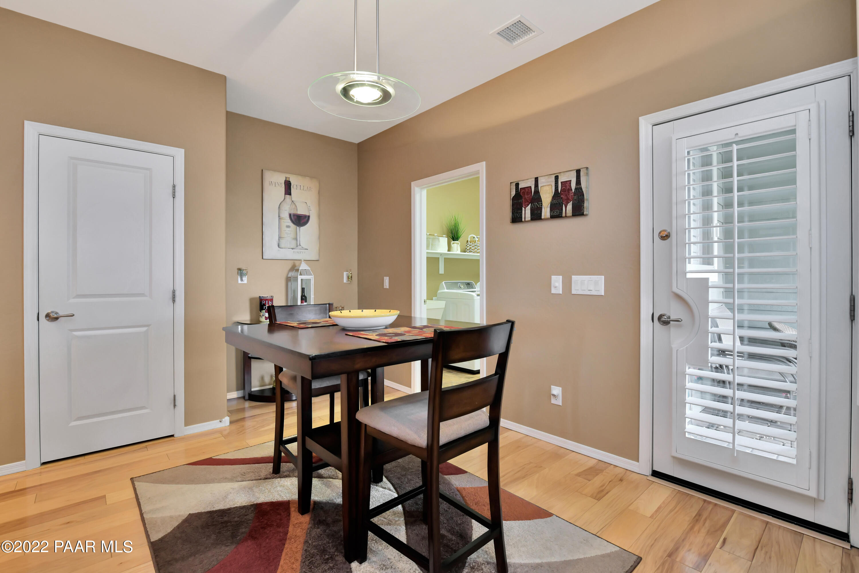 7209 Woolsey Ranch Road Prescott Valley, AZ 86314 - Photo 19 of 49 a view of a dining room with furniture and window