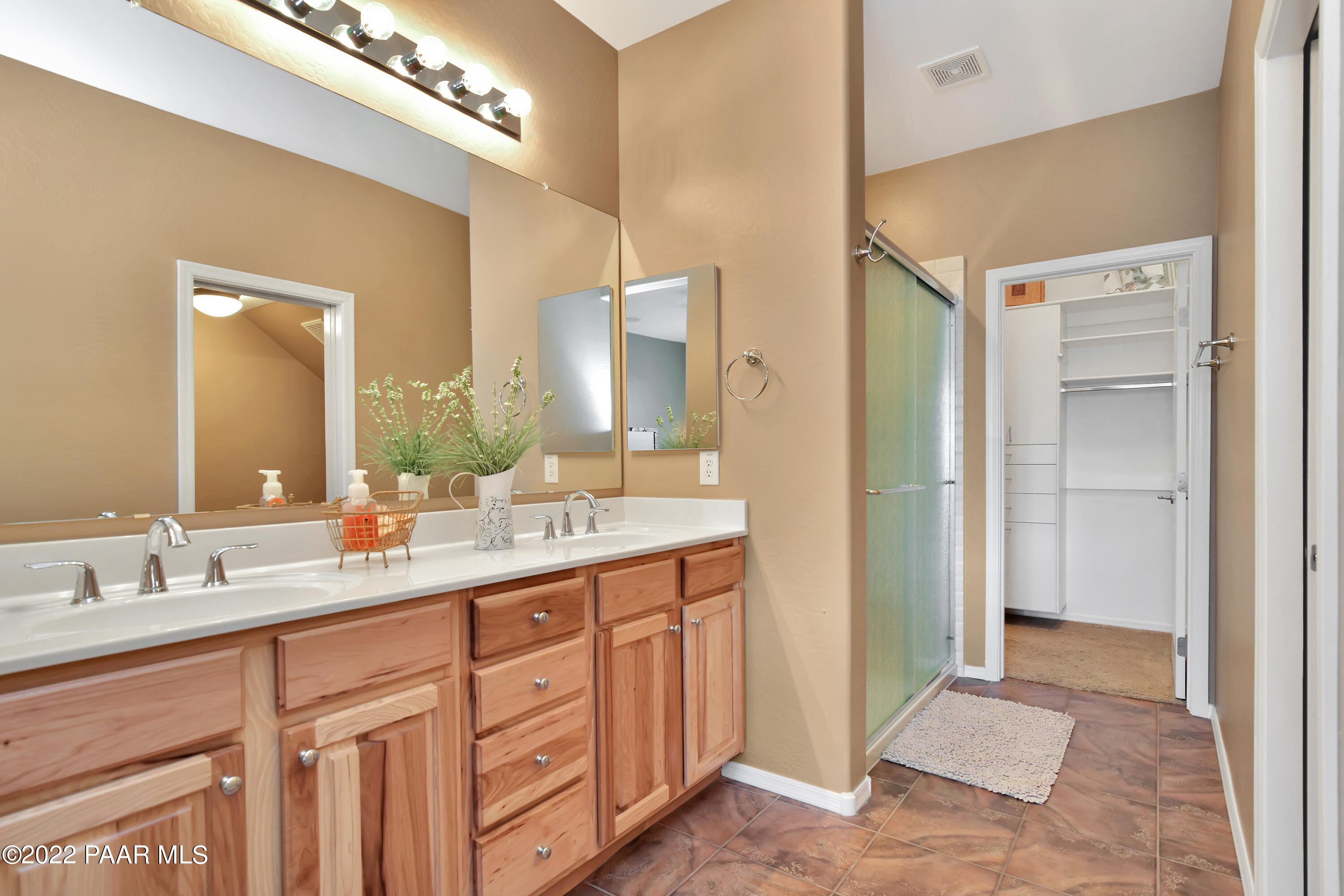 7209 Woolsey Ranch Road Prescott Valley, AZ 86314 - Photo 22 of 49 a bathroom with a double vanity sink and a mirror