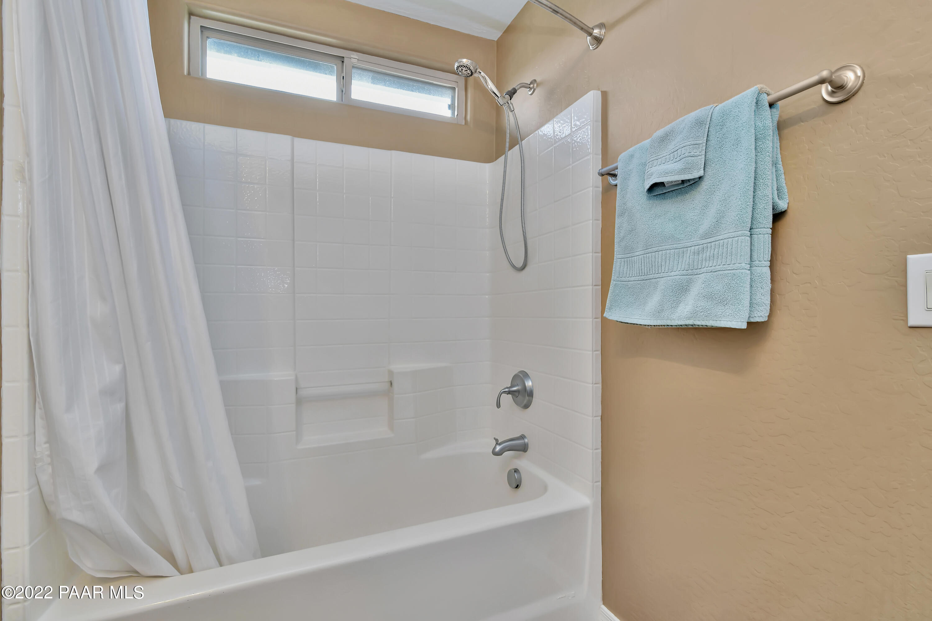 7209 Woolsey Ranch Road Prescott Valley, AZ 86314 - Photo 30 of 49 a bathroom with a bathtub and shower