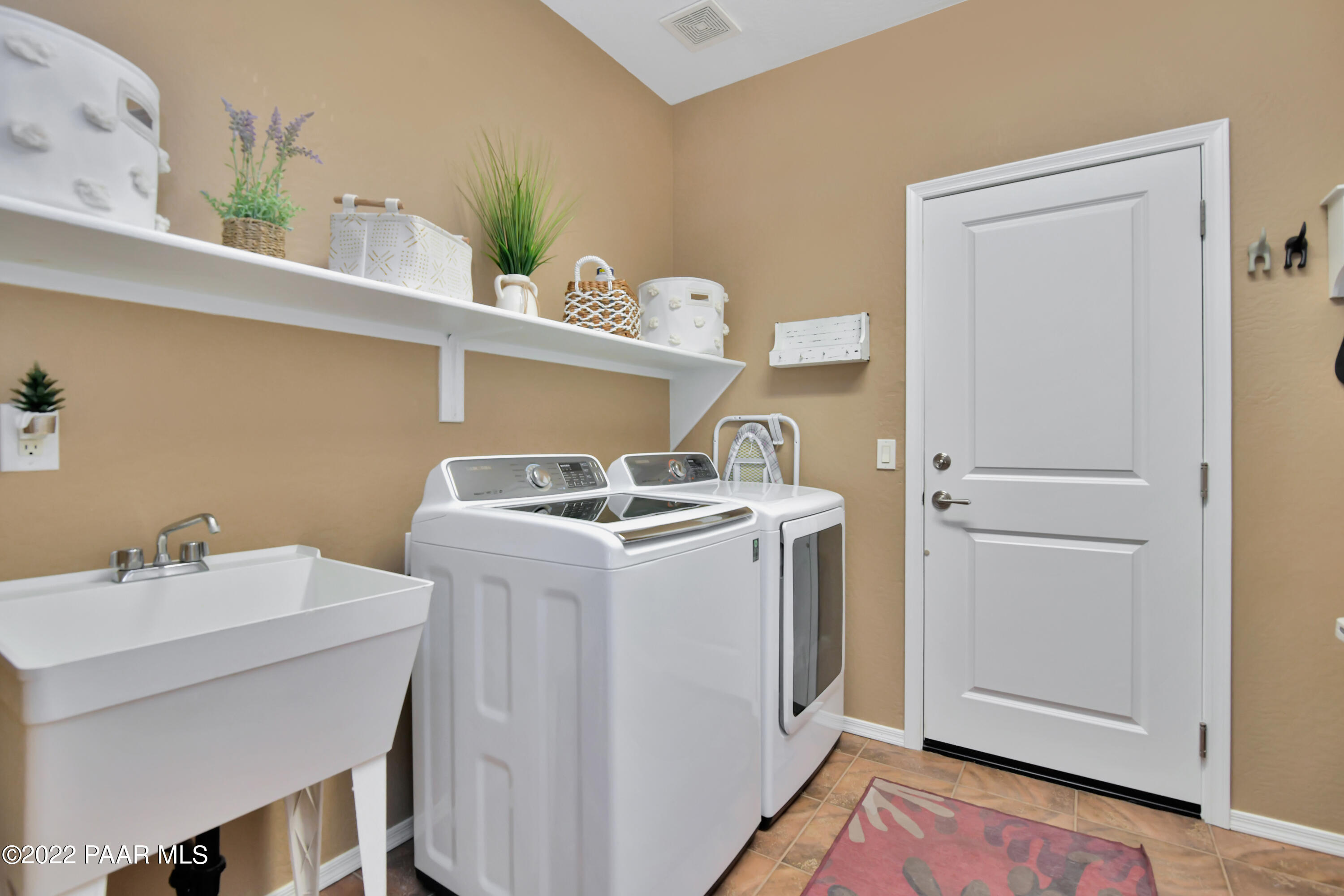 7209 Woolsey Ranch Road Prescott Valley, AZ 86314 - Photo 31 of 49 a room with storage and utility