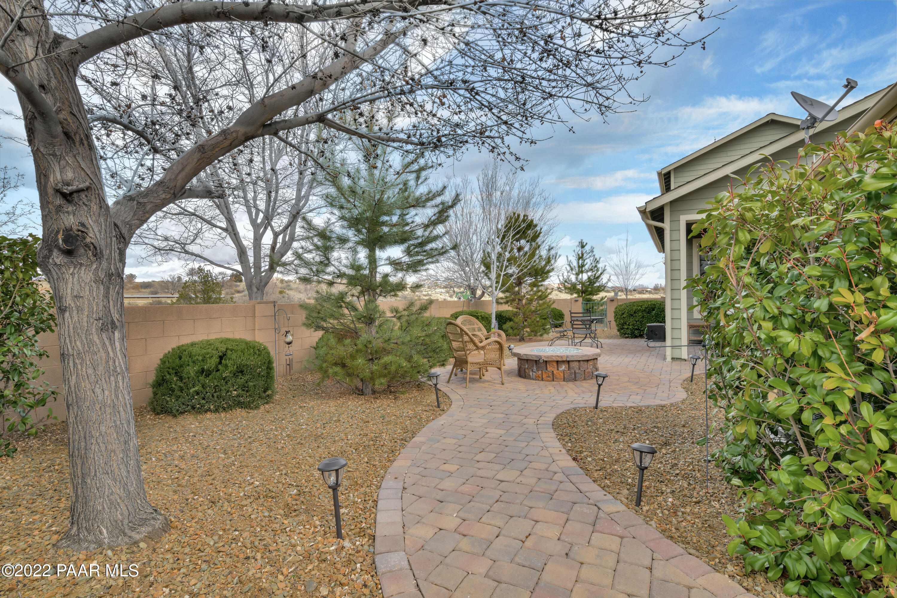 7209 Woolsey Ranch Road Prescott Valley, AZ 86314 - Photo 36 of 49 a view of a backyard with sitting area