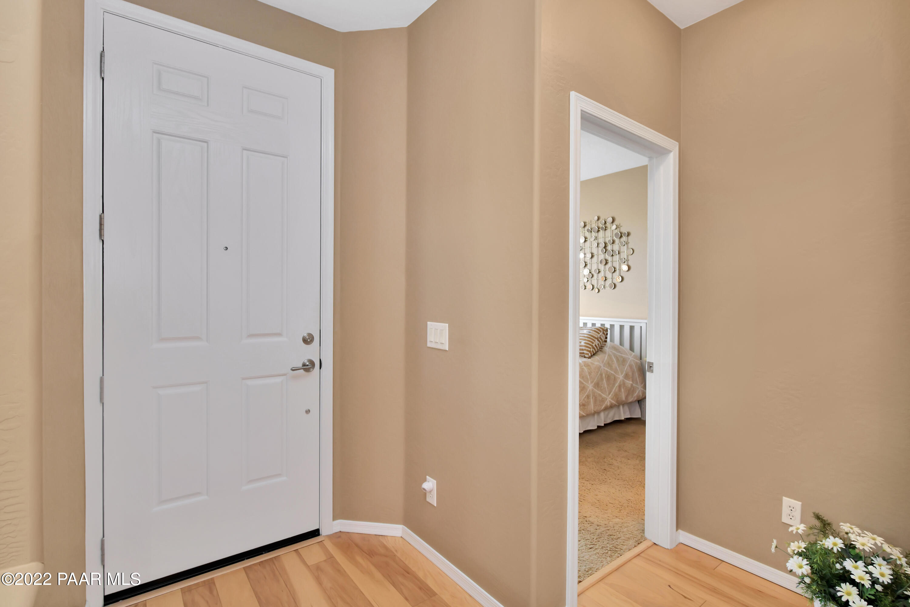 7209 Woolsey Ranch Road Prescott Valley, AZ 86314 - Photo 7 of 49 a view of a bedroom from the hallway