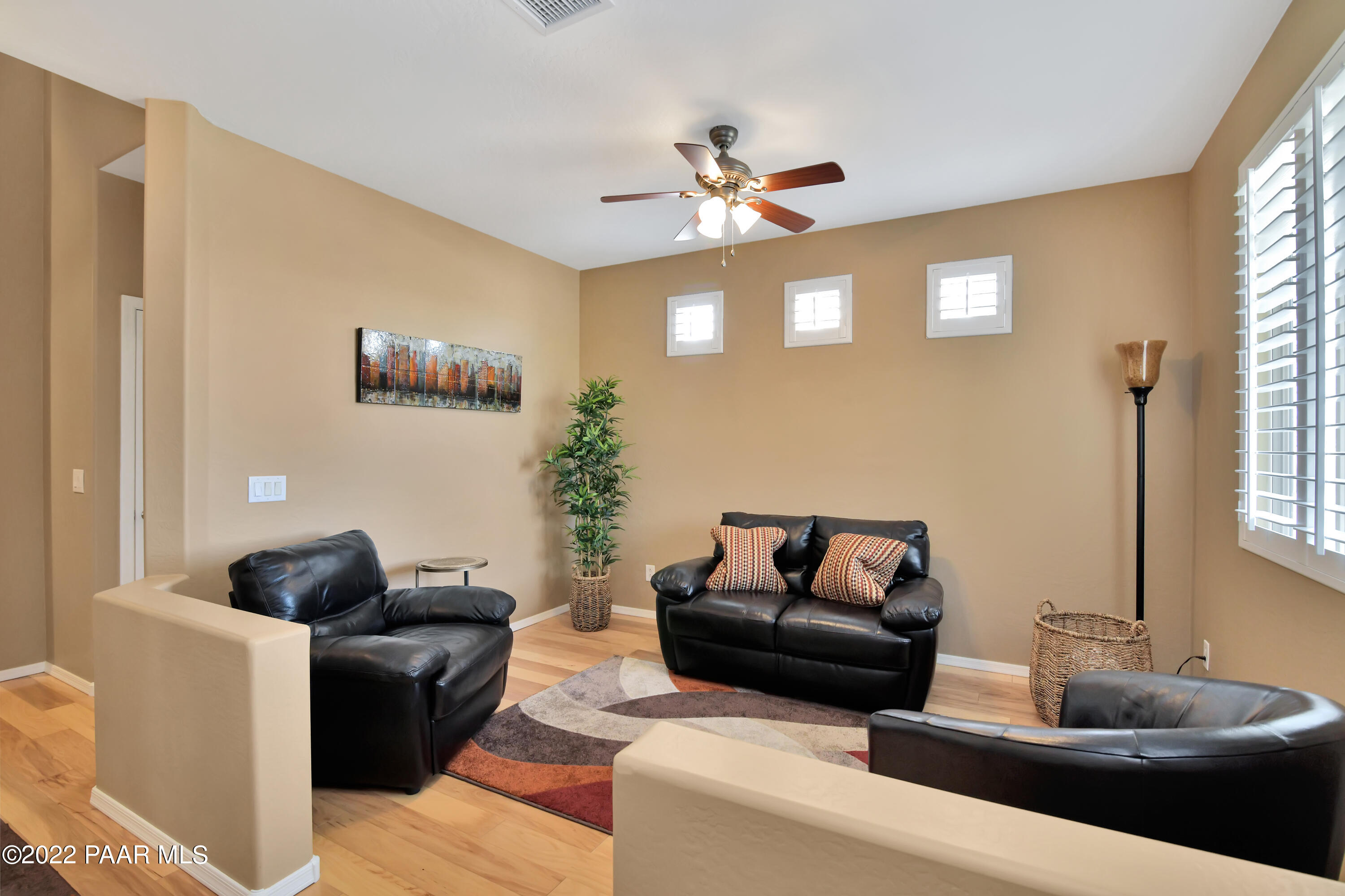 7209 Woolsey Ranch Road Prescott Valley, AZ 86314 - Photo 8 of 49 a living room with furniture and a window