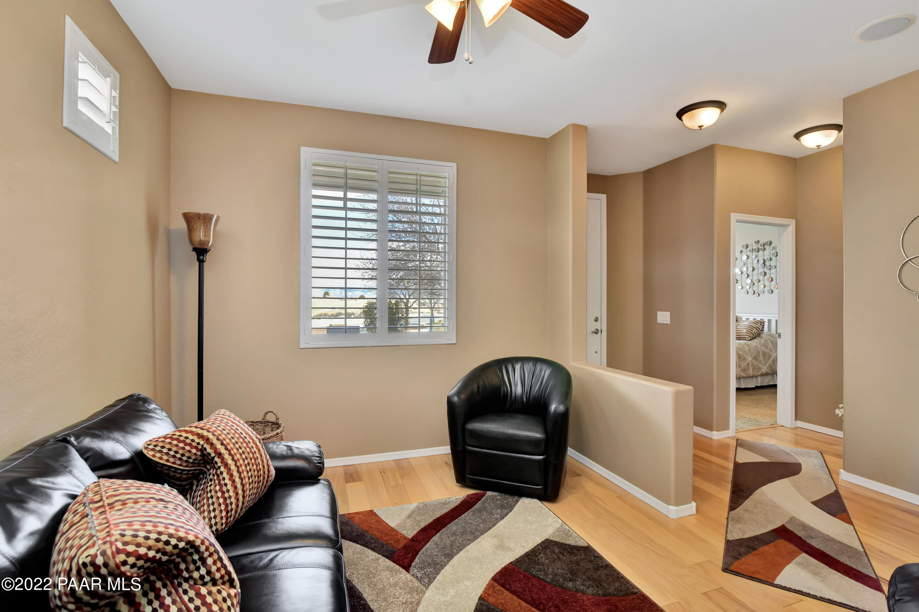 7209 Woolsey Ranch Road Prescott Valley, AZ 86314 - Photo 9 of 49 a living room with furniture and a window