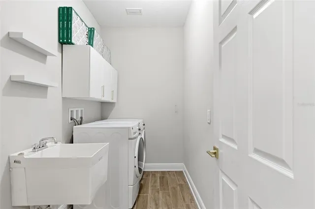 a utility room with dryer and washer