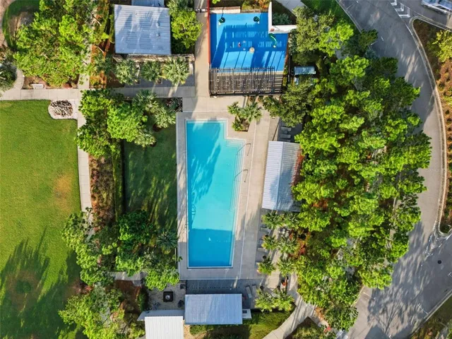 an aerial view of a houses with a lake view