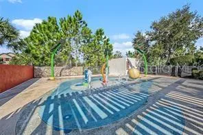 an aerial view of a houses with a lake view