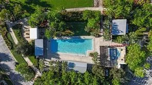 an aerial view of residential building and lake