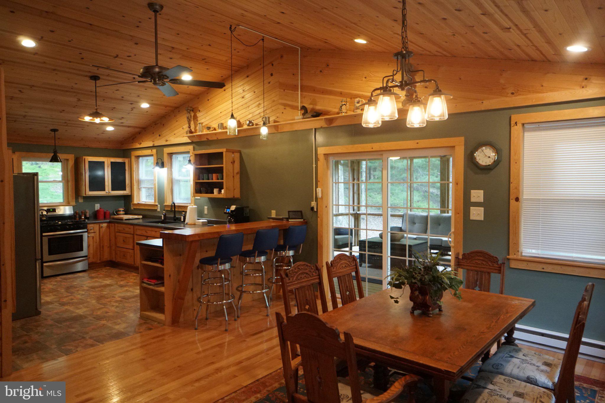 150 Sharp Ridge Lane Franklin, WV 26807 - Photo 35 of 69 Cozy cabin kitchen with rustic charm.
