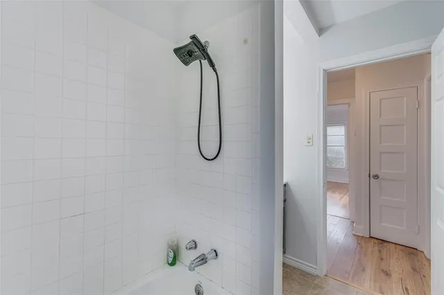 a view of a bathroom with a glass door shower and vanity