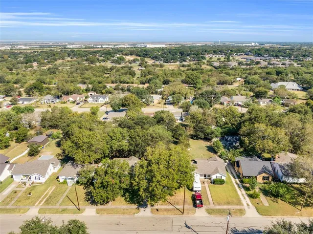 an aerial view of residential house with outdoor space and swimming pool