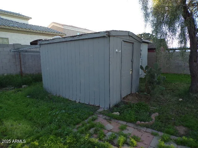 a backyard of a house with plants and trees