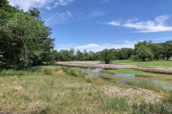 a view of lake with green space