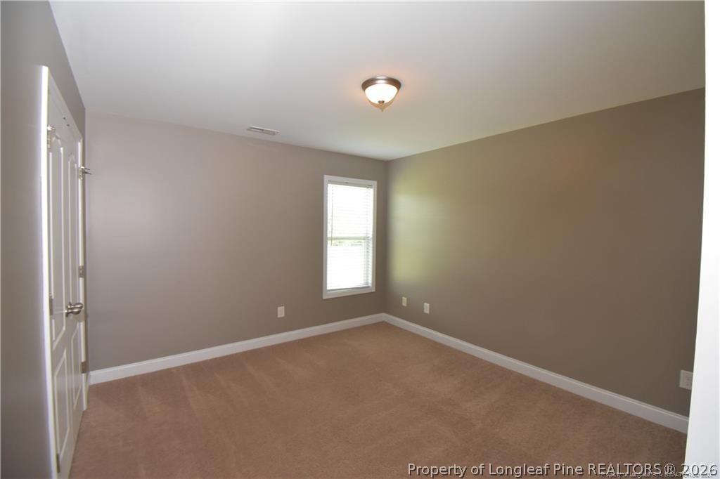 131 South Prince Henry Way Cameron, NC 28326 - Photo 18 of 26 a view of an empty room with a window