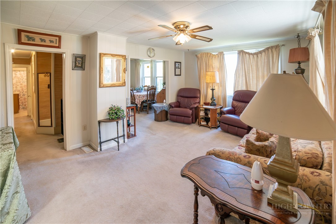 292 Little Elk Road Elk Park, NC 28622 - Photo 12 of 28 a living room with furniture and a large window
