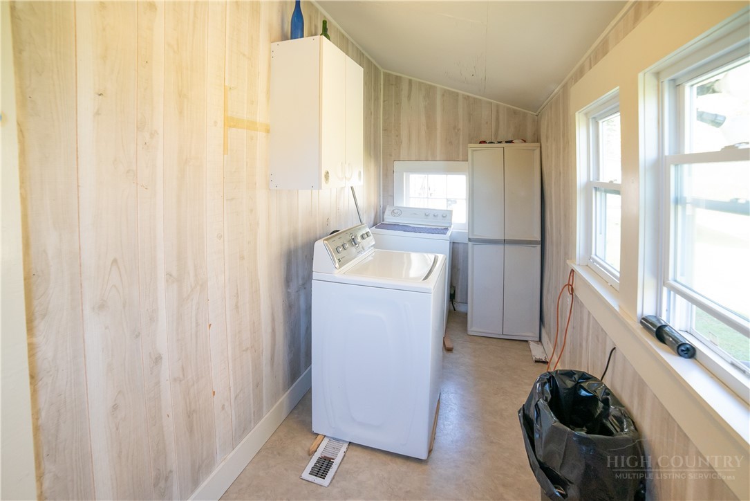 292 Little Elk Road Elk Park, NC 28622 - Photo 17 of 28 a utility room with a window dryer and washer
