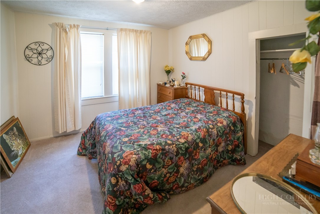 292 Little Elk Road Elk Park, NC 28622 - Photo 21 of 28 a bedroom with a bed and a window