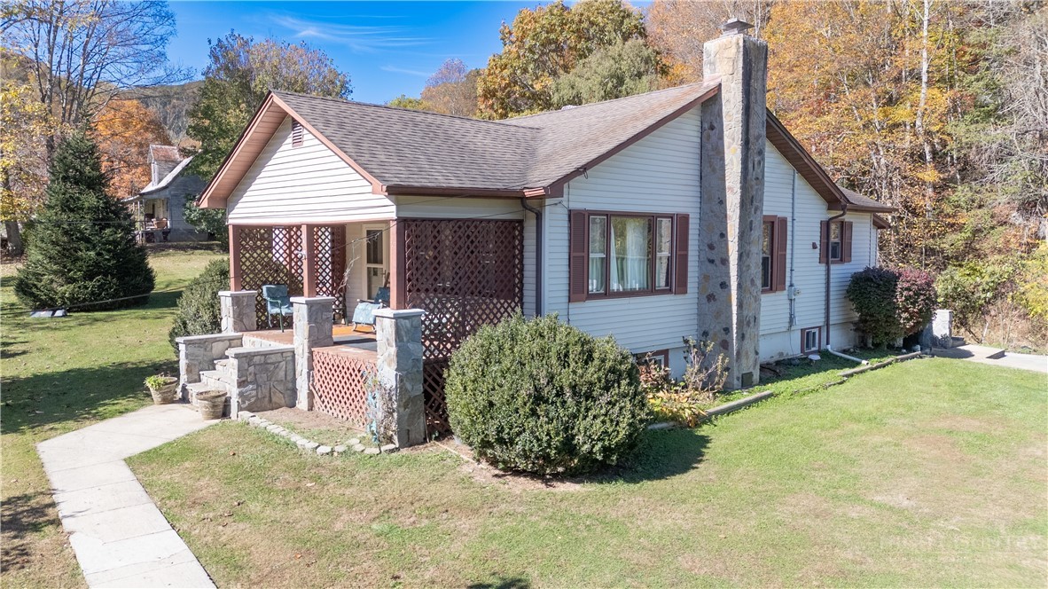 292 Little Elk Road Elk Park, NC 28622 - Photo 26 of 28 a view of a house with backyard and sitting area