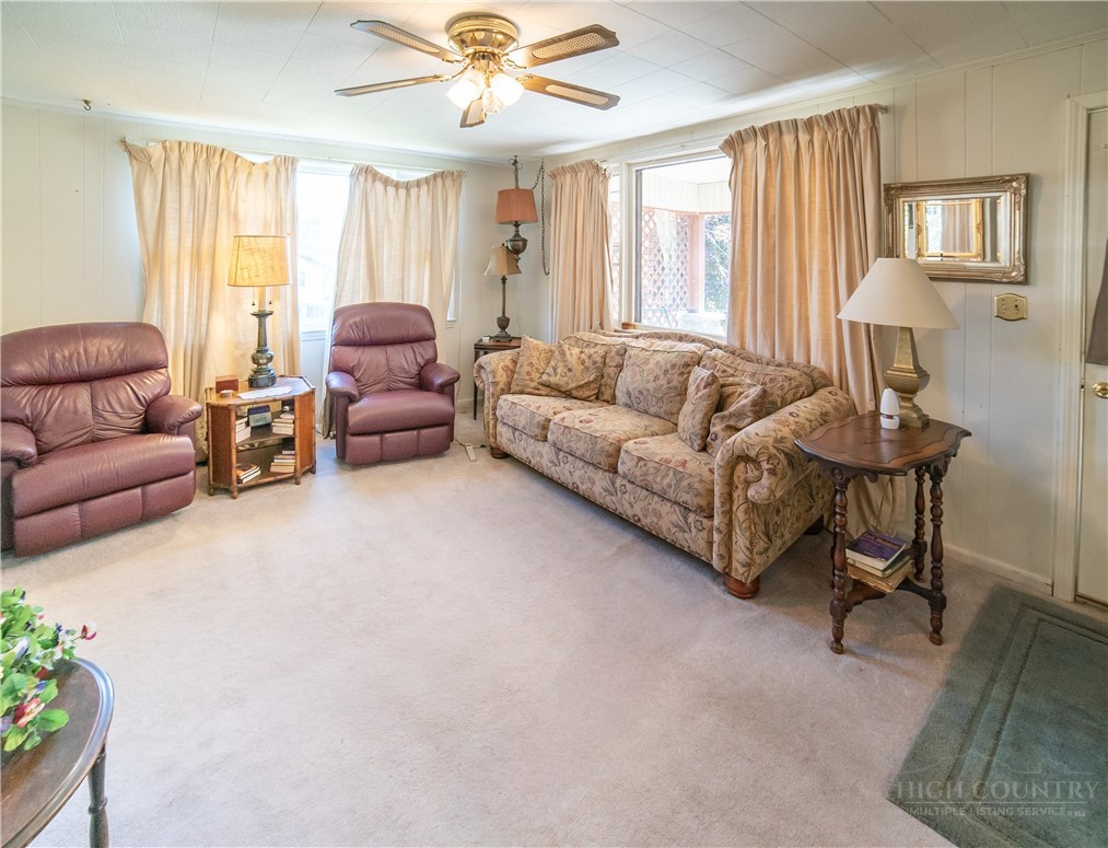 292 Little Elk Road Elk Park, NC 28622 - Photo 8 of 28 a living room with furniture and a large window