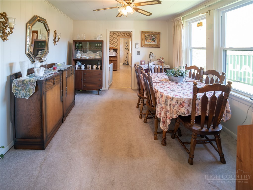 292 Little Elk Road Elk Park, NC 28622 - Photo 9 of 28 a dining room with furniture and window
