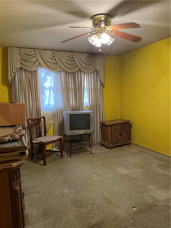 350 Peyton Place Southwest Atlanta, GA 30311 - Photo 11 of 14 a living room with furniture and a chandelier