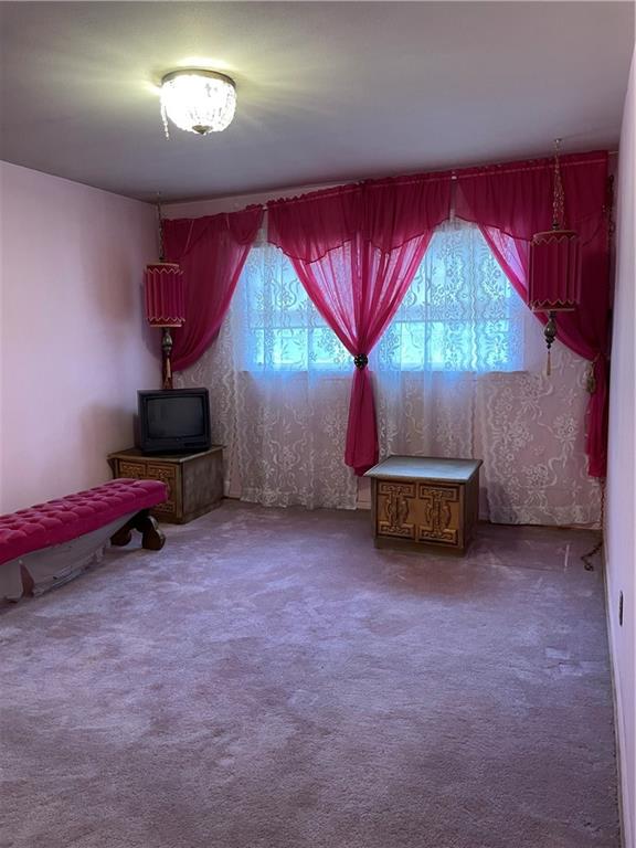 350 Peyton Place Southwest Atlanta, GA 30311 - Photo 5 of 14 an empty room with windows and fan