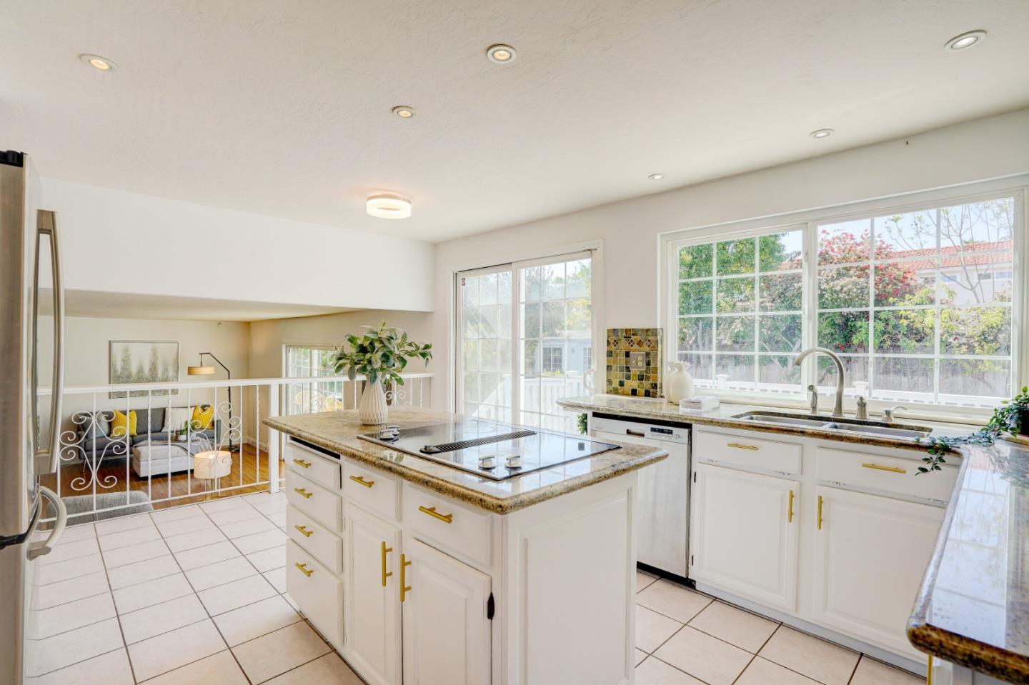 2945 Berryessa Road San Jose, CA 95132 - Photo 12 of 49 a kitchen with granite countertop a sink and white cabinets