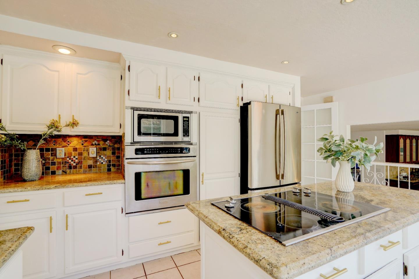 2945 Berryessa Road San Jose, CA 95132 - Photo 15 of 49 a kitchen with stainless steel appliances granite countertop a sink and a refrigerator