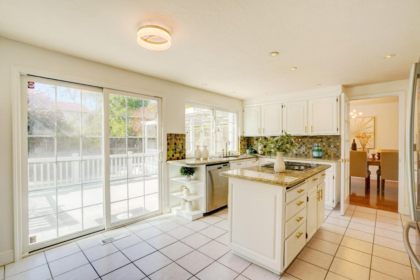 2945 Berryessa Road San Jose, CA 95132 - Photo 17 of 49 a kitchen with white cabinets and white appliances