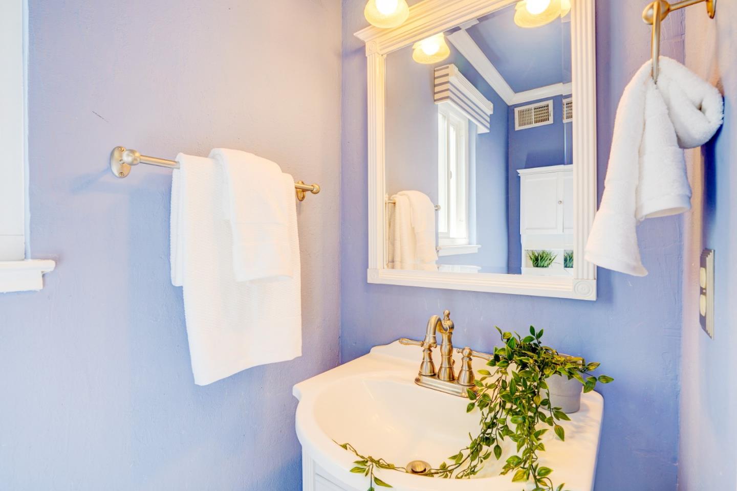 2945 Berryessa Road San Jose, CA 95132 - Photo 21 of 49 a bathroom with a sink and mirror