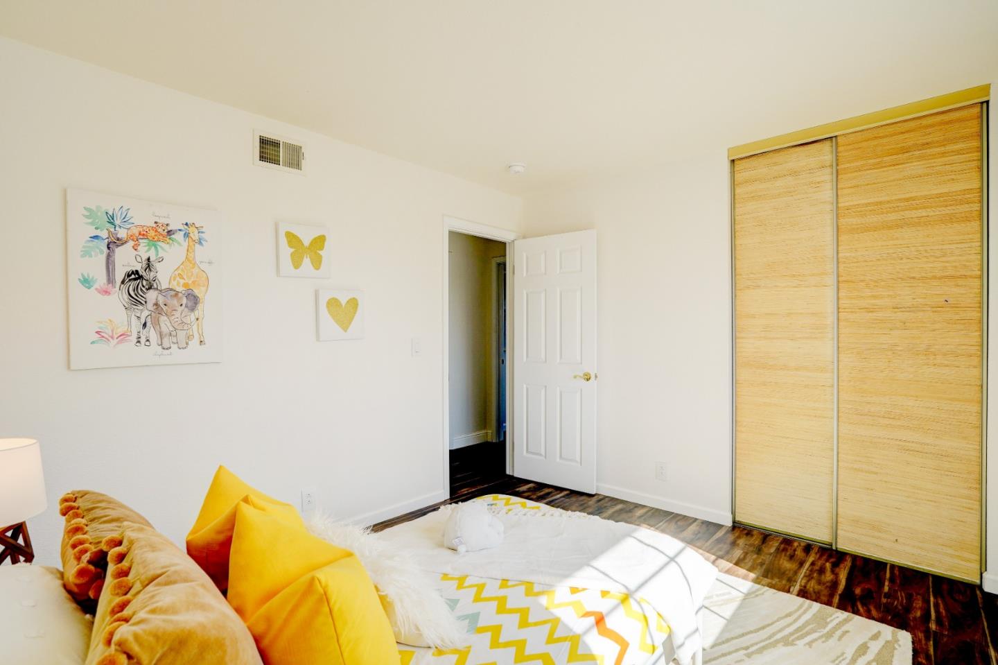 2945 Berryessa Road San Jose, CA 95132 - Photo 27 of 49 a bedroom with a bed and a painting on the wall