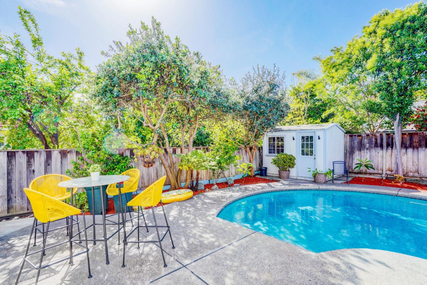 2945 Berryessa Road San Jose, CA 95132 - Photo 39 of 49 a swimming pool with chair and table in the patio