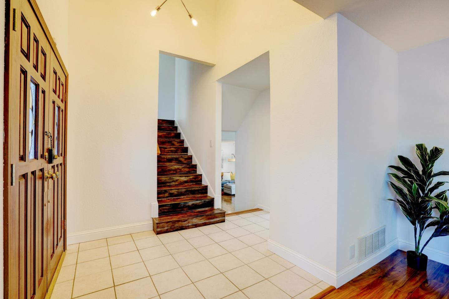 2945 Berryessa Road San Jose, CA 95132 - Photo 4 of 49 a view of entryway with wooden floor and stairs