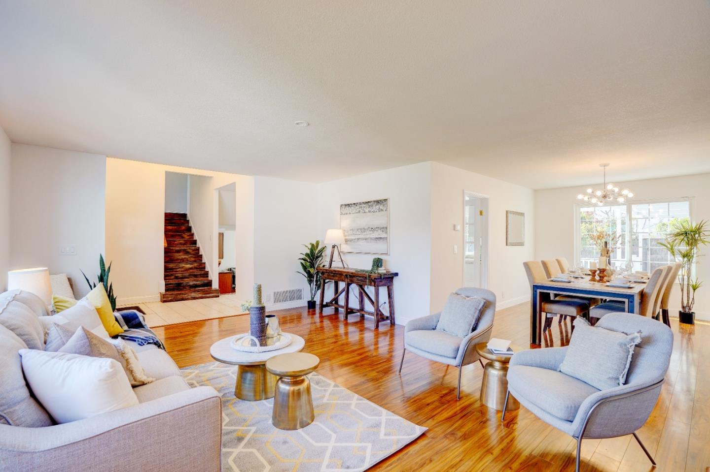 2945 Berryessa Road San Jose, CA 95132 - Photo 8 of 49 a living room with fireplace and a dining table with chairs