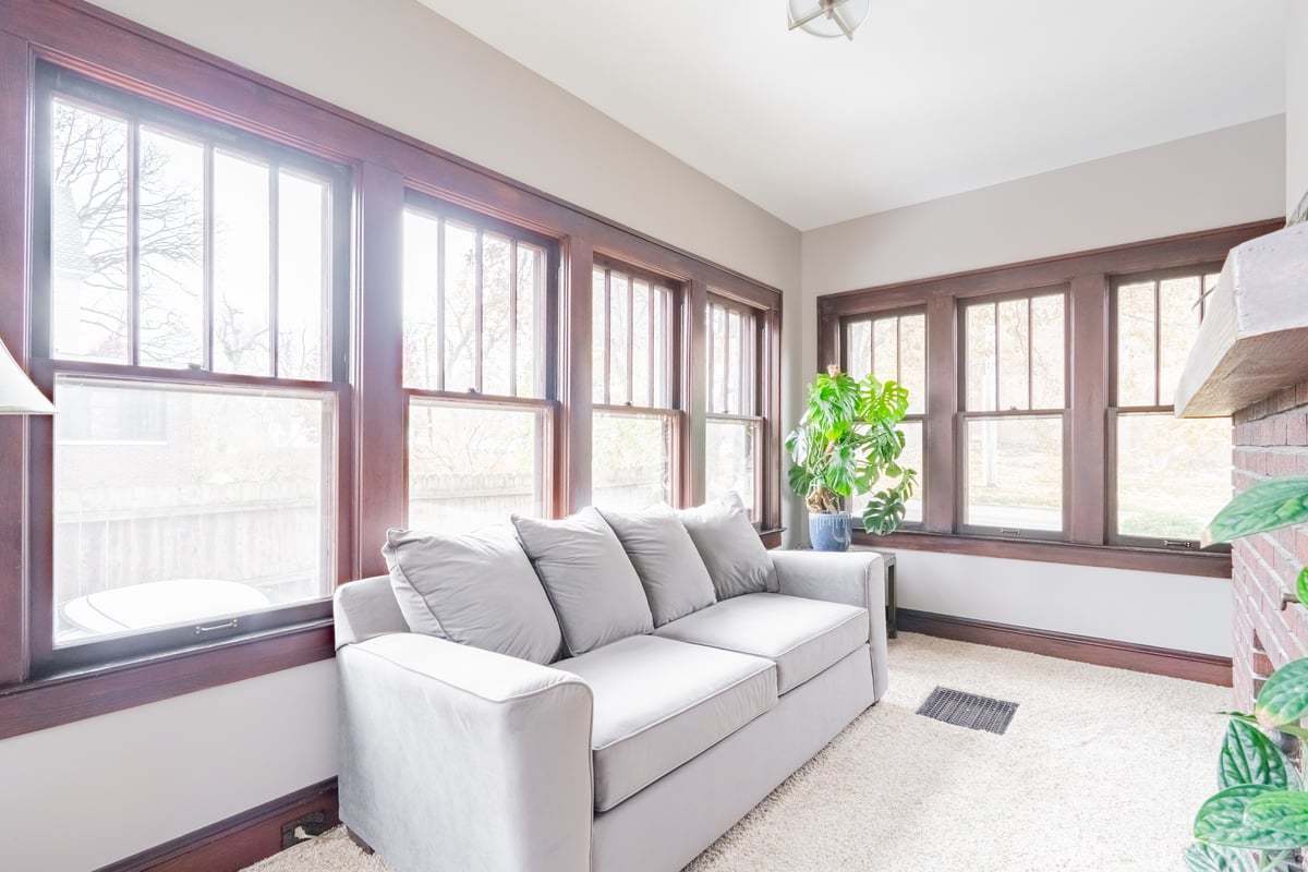 412 West Virginia Avenue Normal, IL 61761 - Photo 16 of 42 a living room with furniture and floor to ceiling windows