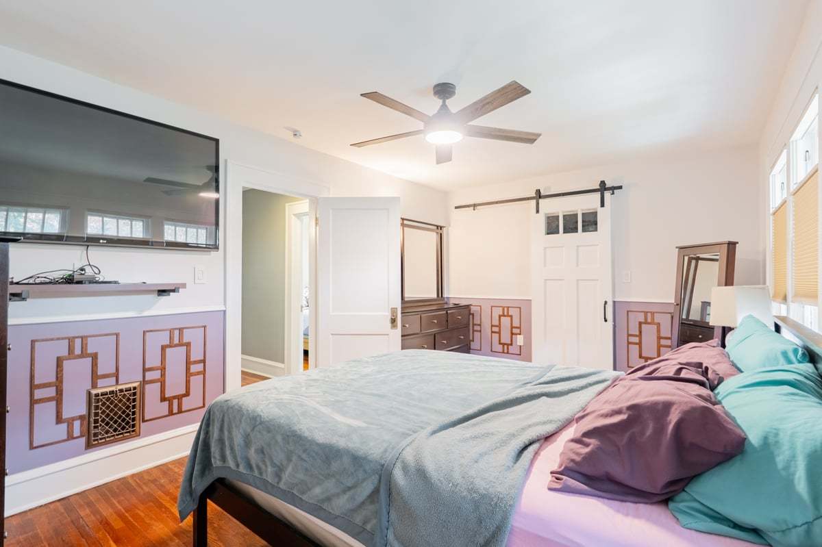 412 West Virginia Avenue Normal, IL 61761 - Photo 24 of 42 a bedroom with a large bed and a chandelier