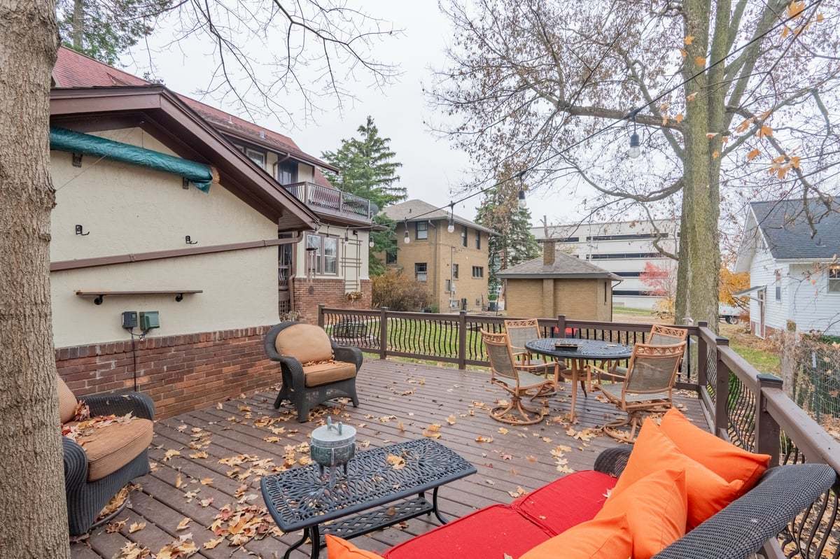 412 West Virginia Avenue Normal, IL 61761 - Photo 31 of 42 a view of a patio with couches table and chairs under an umbrella
