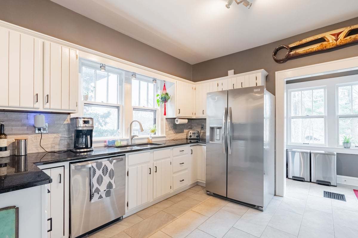 412 West Virginia Avenue Normal, IL 61761 - Photo 5 of 42 a kitchen with stainless steel appliances a refrigerator sink and cabinets