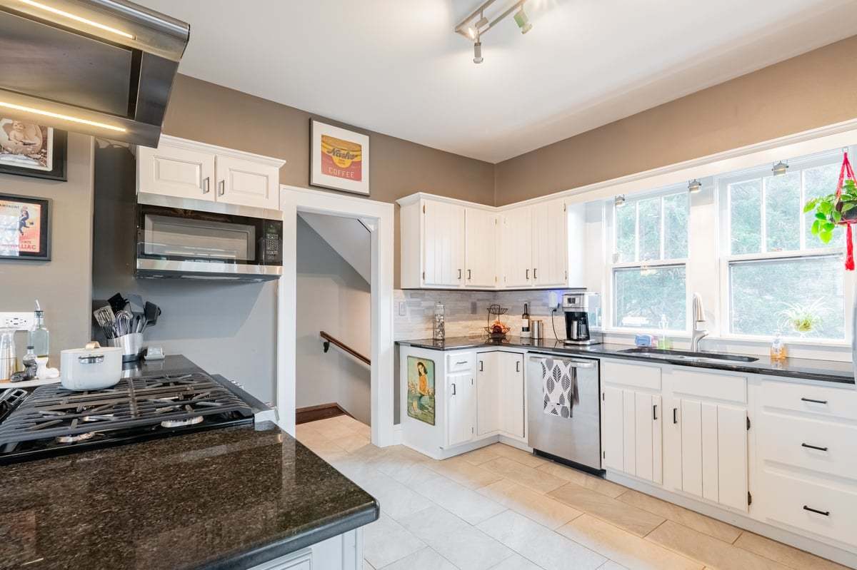 412 West Virginia Avenue Normal, IL 61761 - Photo 10 of 42 a kitchen with white cabinets and appliances