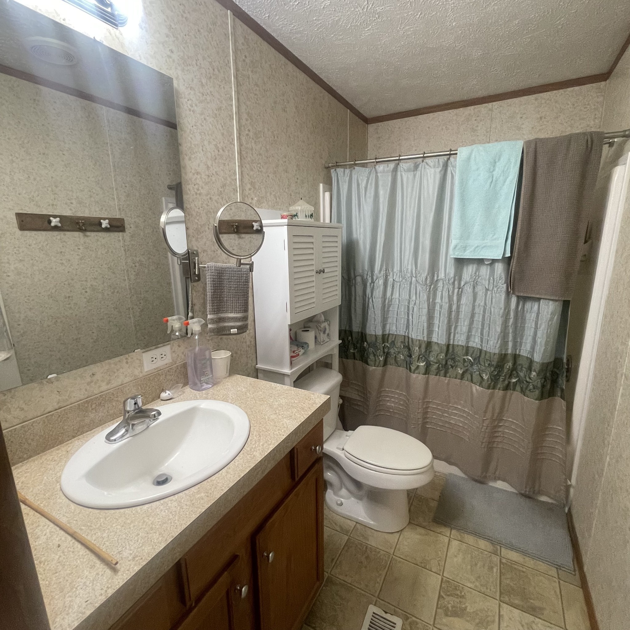 75 Snell Road Ethridge, TN 38456 - Photo 25 of 51 a bathroom with a sink toilet and shower