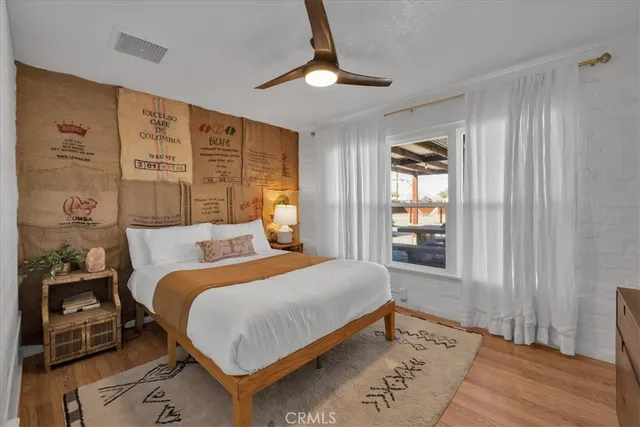 a bedroom with a large bed and a window