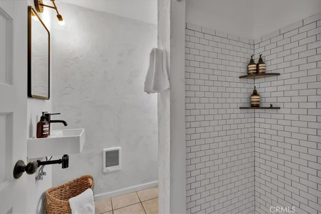 a bathroom with a sink and mirror